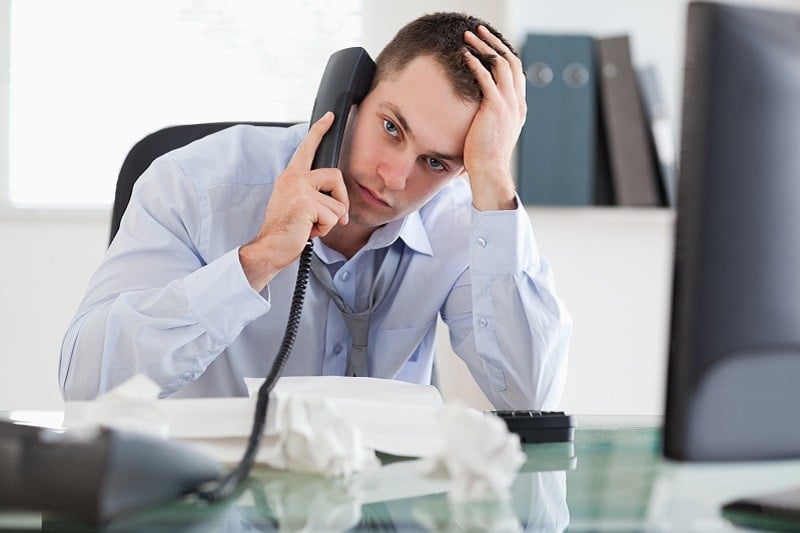 8363791-close-up-of-frustrated-businessman-on-the-phone